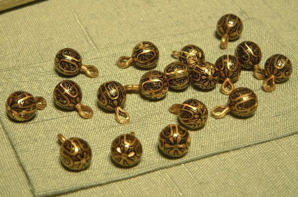 Gold buttons, with a Moorish pattern against a dark blue enamel background, from the burial costume of John III (1592), Uppsala, Sweden